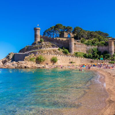 9 European Beaches with Coastal Castle Views