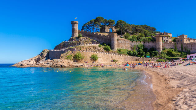 9 European Beaches with Coastal Castle Views