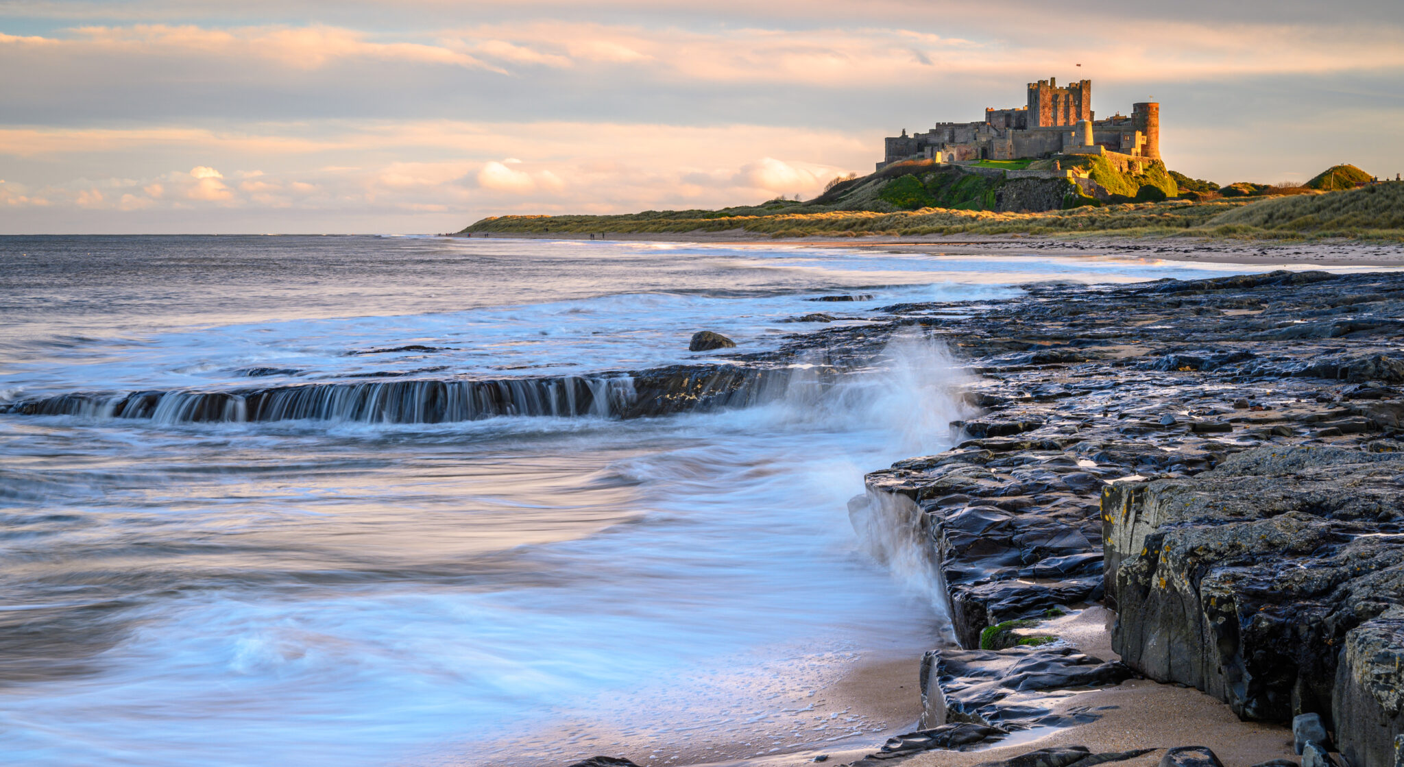 9 European Beaches with Coastal Castle Views