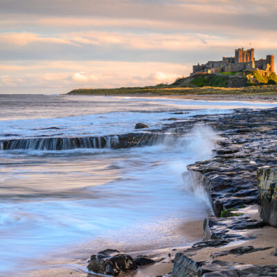 9 European Beaches with Coastal Castle Views