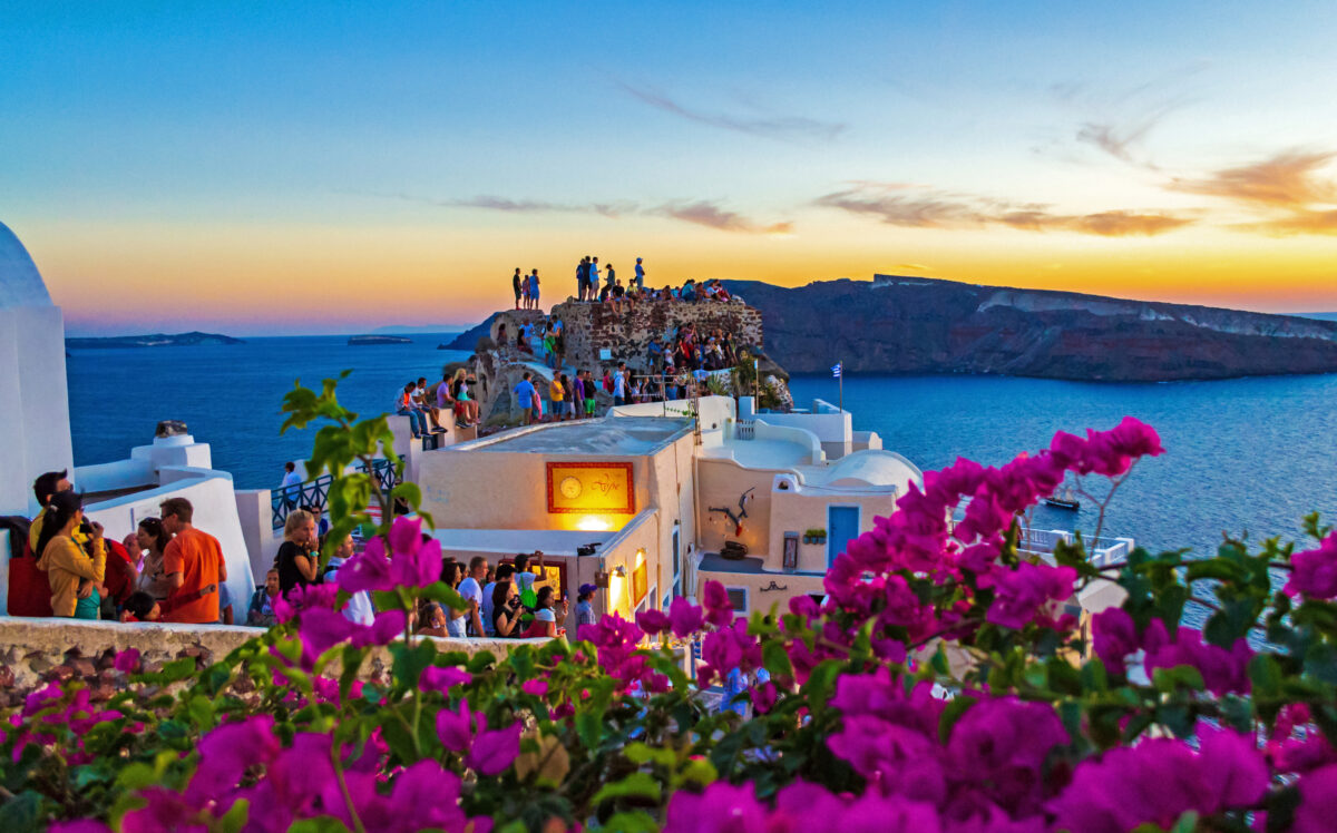 Sunset view of clifftop Castle of Oia Santorini Greece.