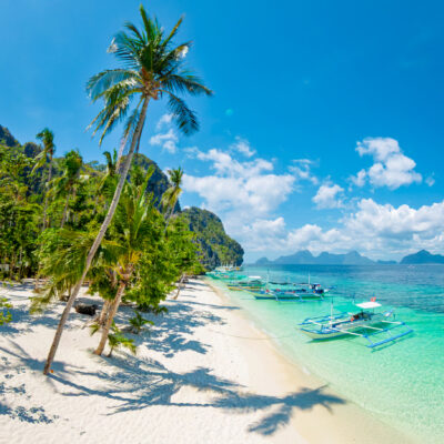 We Asked 6 Travel Experts for Their Favorite Beach Town — The Answers Surprised Us