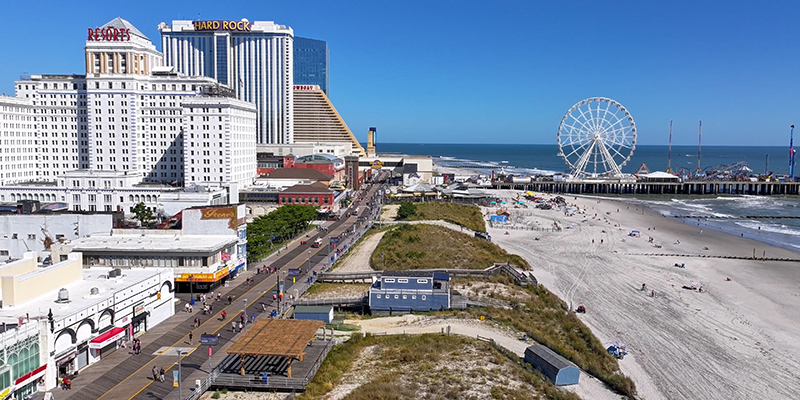 Arial view of the Atlantic City Beach and Boardwalk with beach access stretching over the dunes.