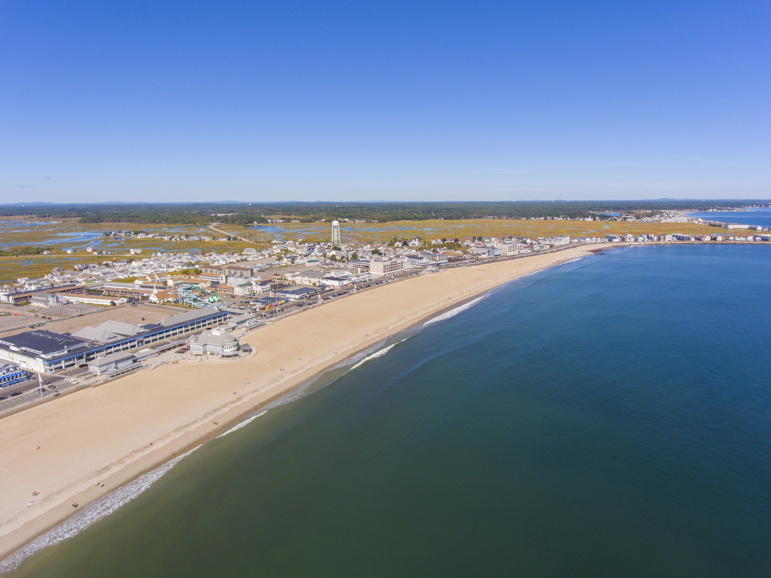 Hampton Beach aerial view including historic waterfront buildings on Ocean Boulevard and Hampton Beach State Park.