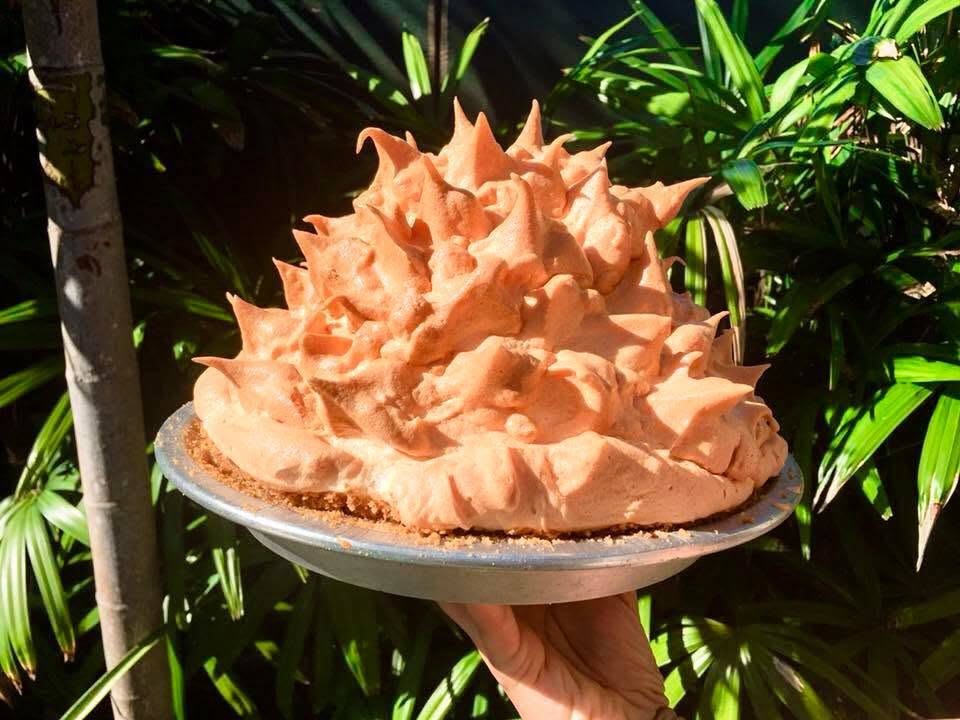 hand holding key lime pie at Blue Heaven